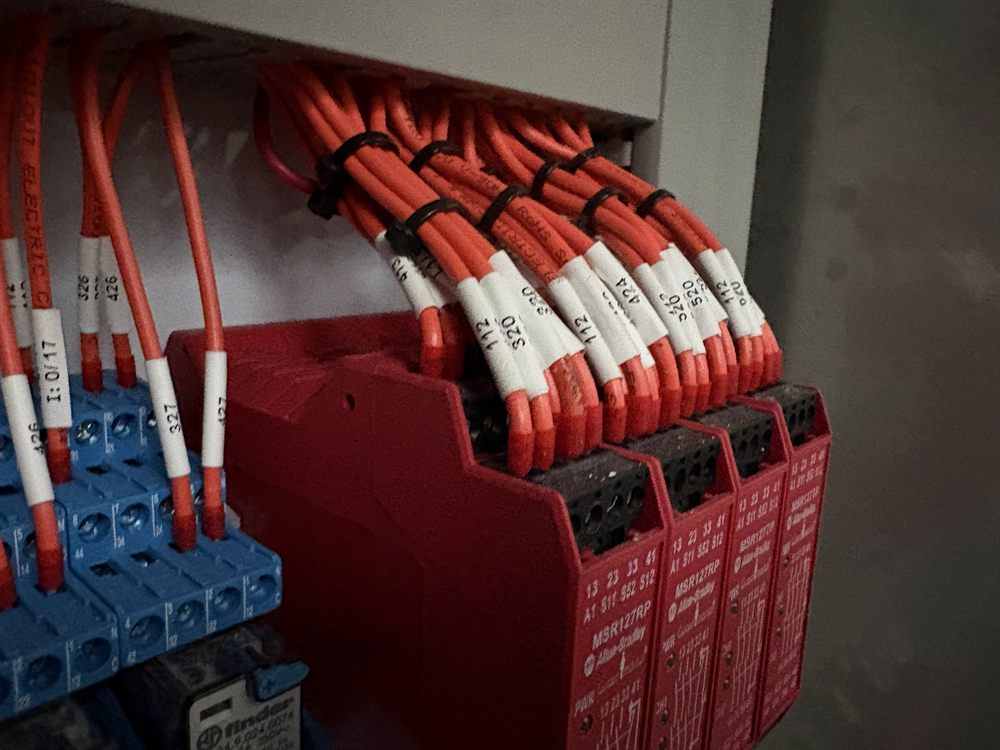 Allen-Bradley safety relays with neatly loomed and labelled wiring